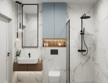 Modern bathroom with marble walls, a glass shower, and black fixtures.