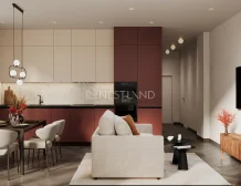 Modern living space featuring a cozy sofa, dining table, stylish kitchen cabinetry, and decorative elements in warm tones.